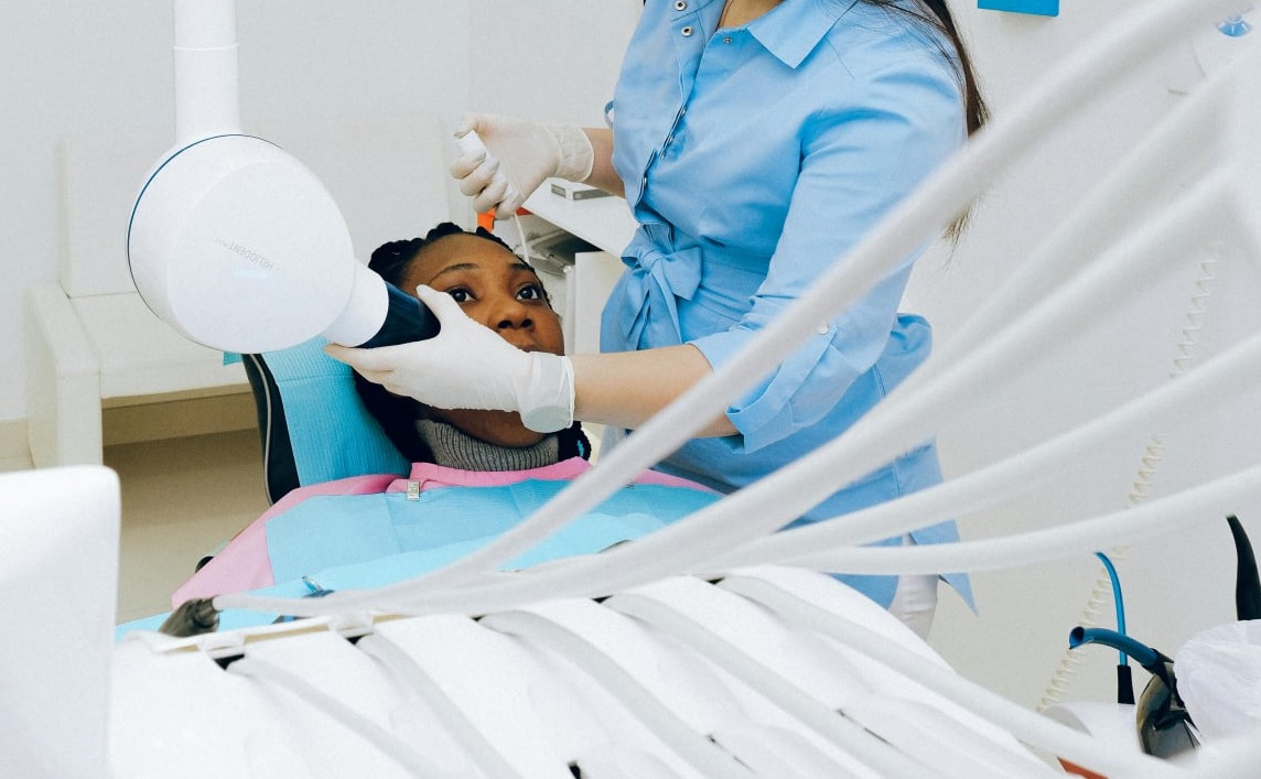A woman receiving TMJ therapy